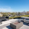 a rooftop deck with seating